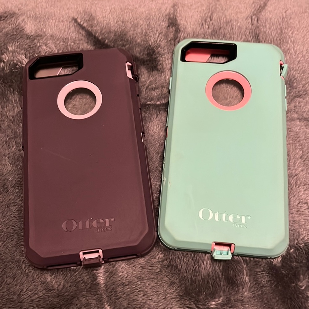 2 otter box 7 plus phone cases. Purple and teal. Fairly used in great shape